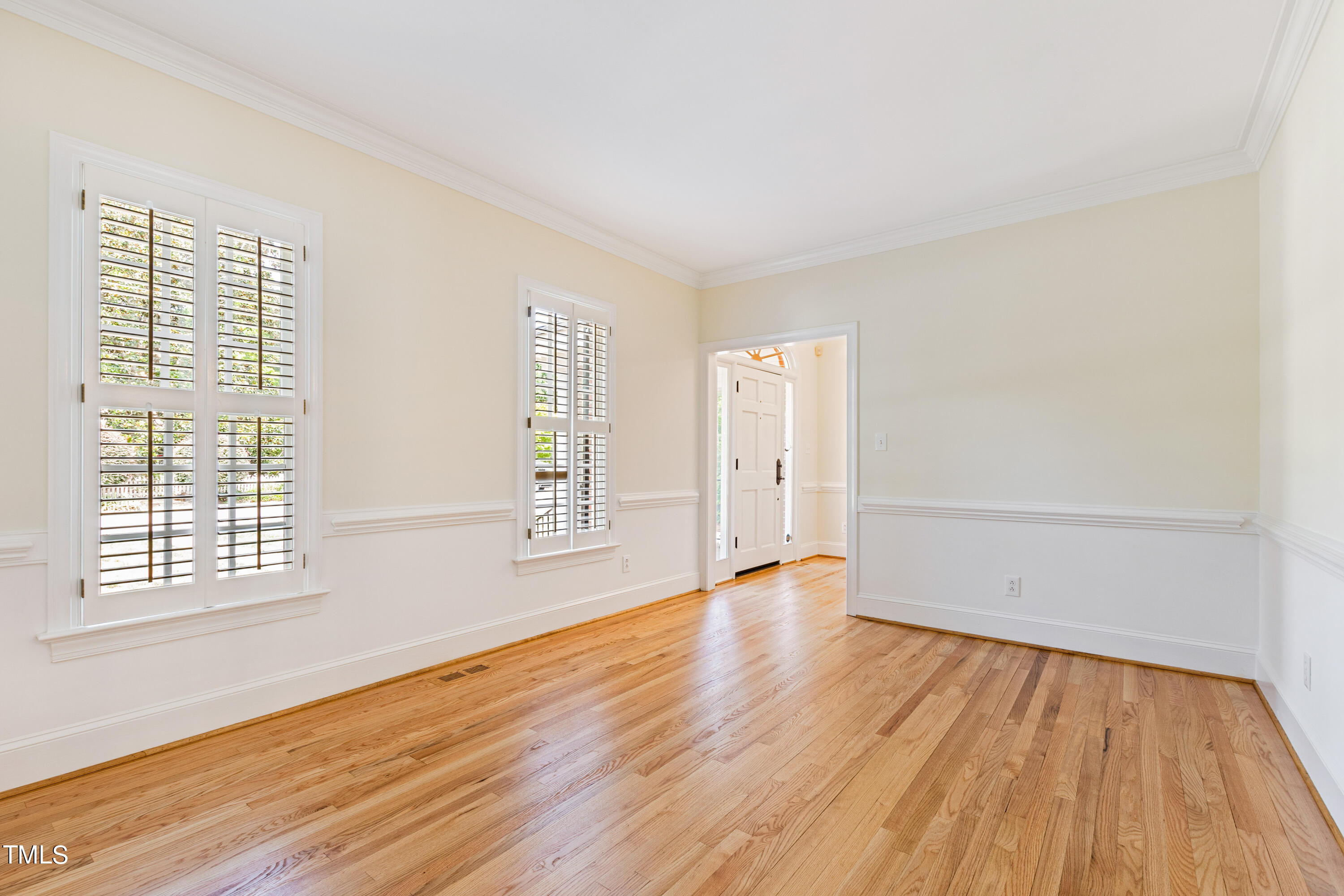 1804 Mcdonald Lane Raleigh, NC 27608 - Photo 25 of 62 an empty room with wooden floor and windows
