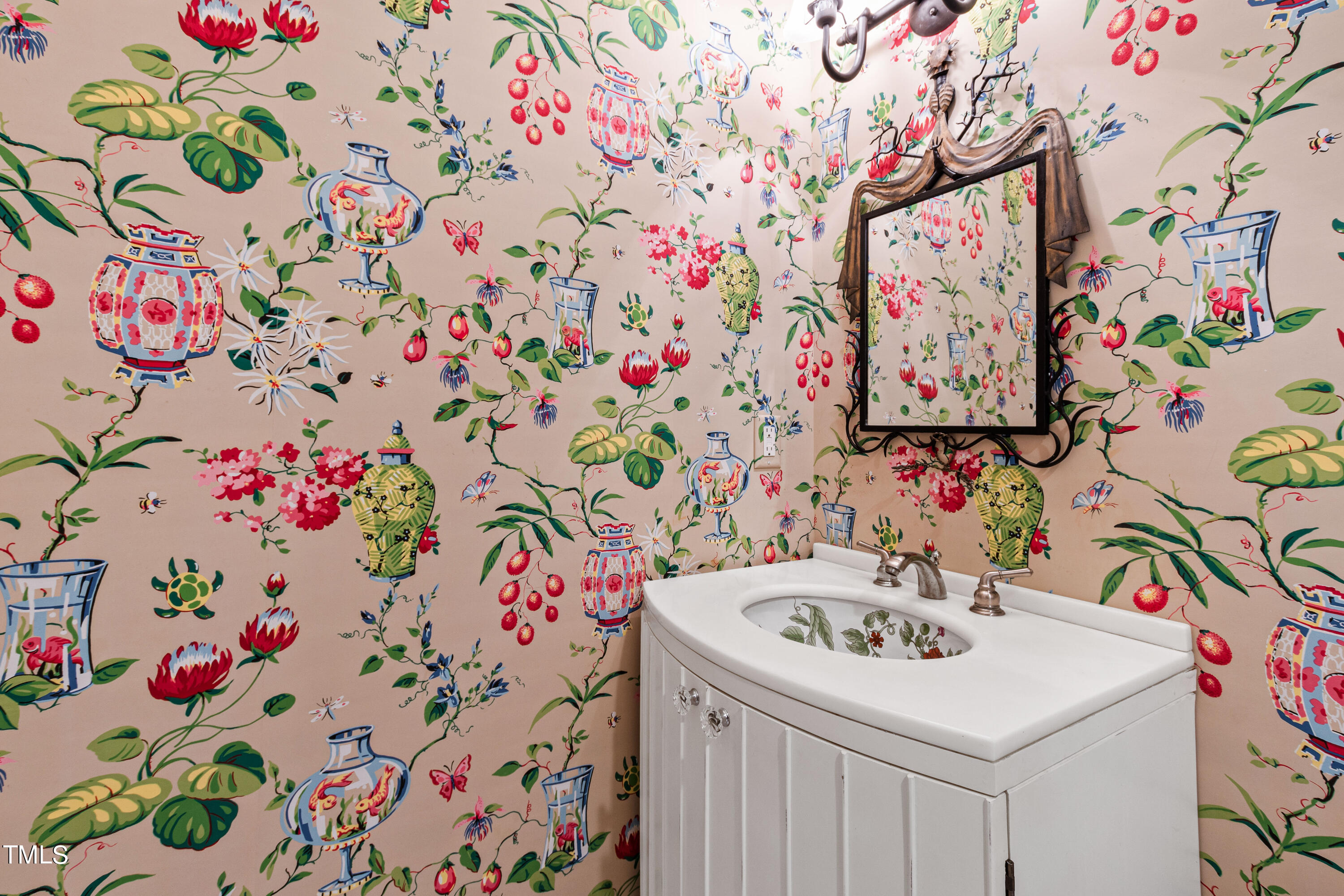1804 Mcdonald Lane Raleigh, NC 27608 - Photo 31 of 62 a bathroom with a sink and mirror
