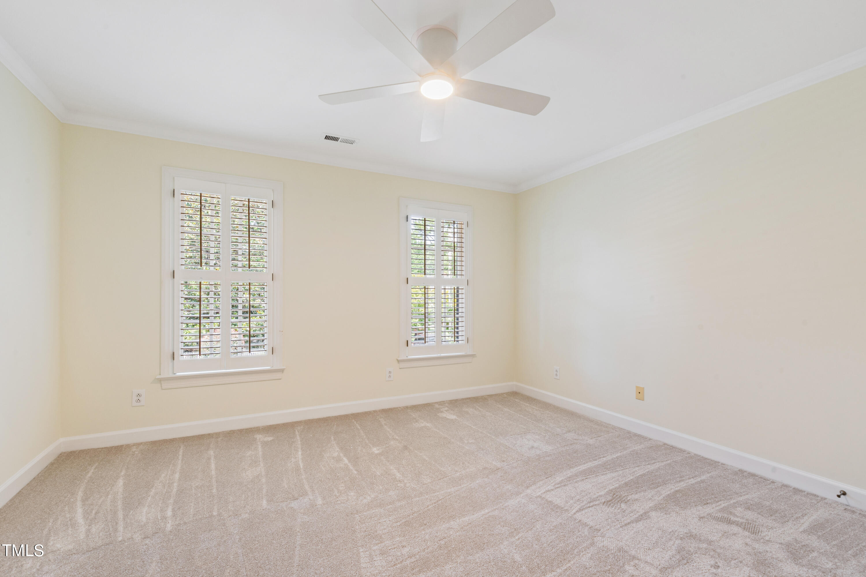 1804 Mcdonald Lane Raleigh, NC 27608 - Photo 36 of 62 an empty room with windows and fan