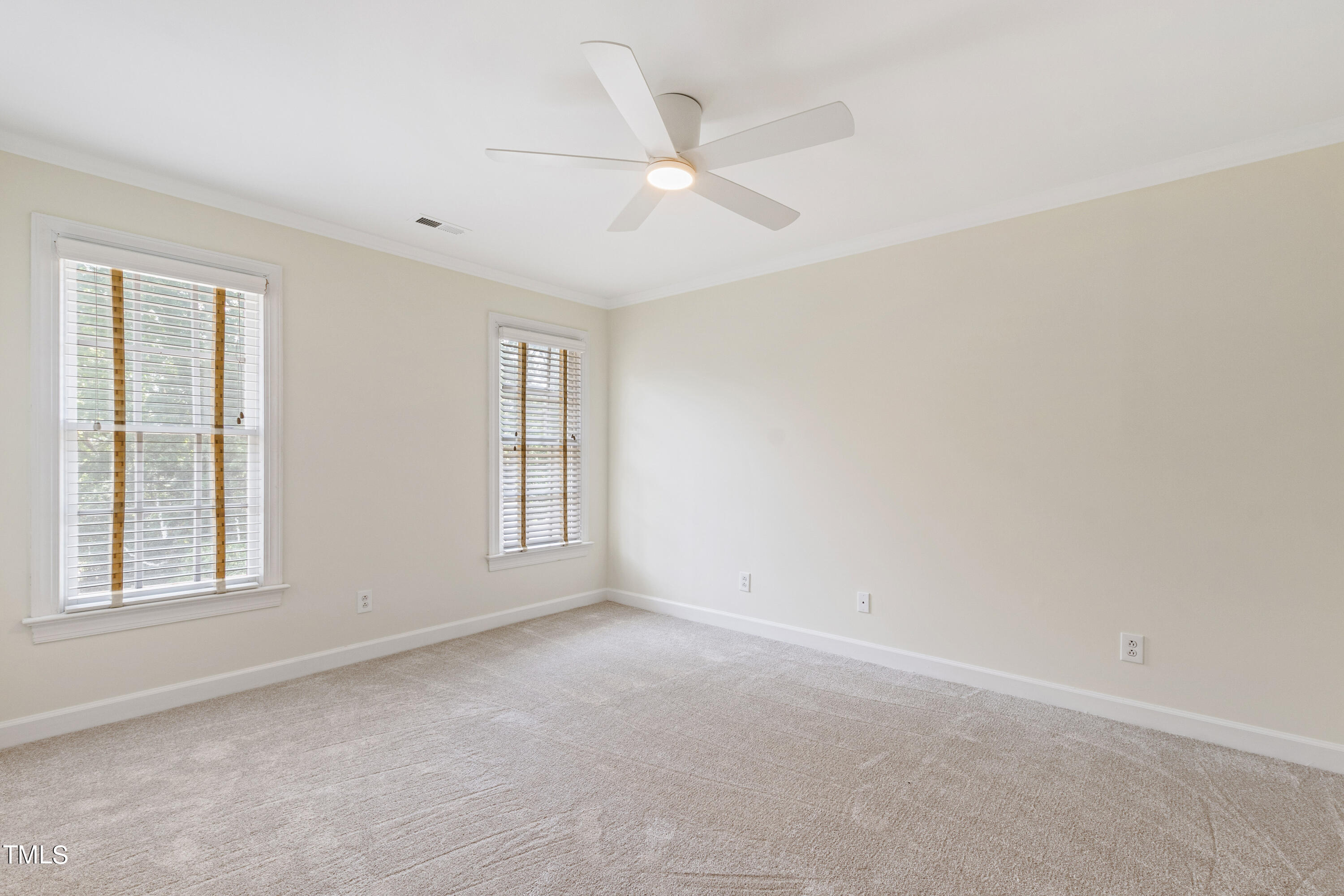 1804 Mcdonald Lane Raleigh, NC 27608 - Photo 38 of 62 an empty room with windows and fan
