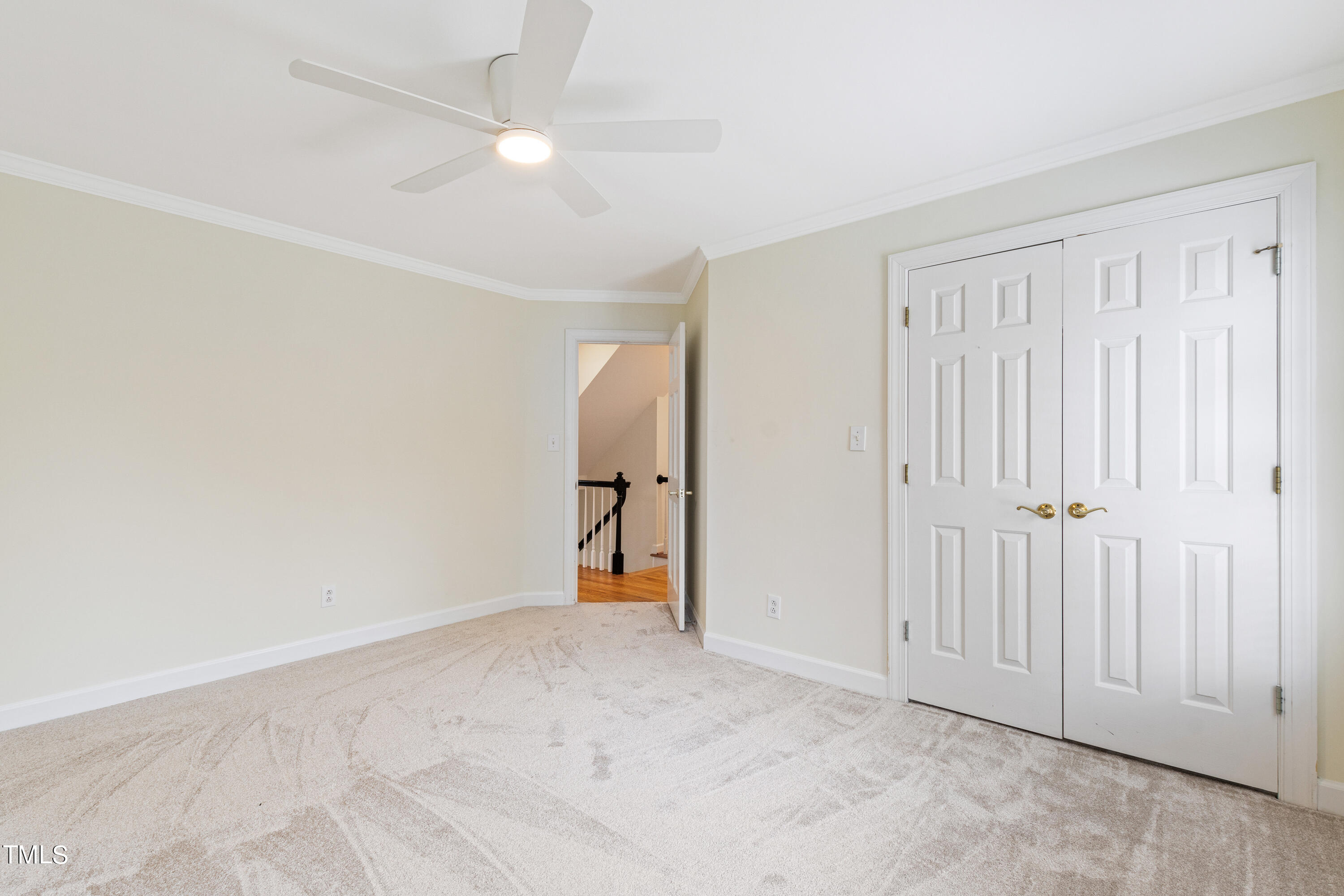 1804 Mcdonald Lane Raleigh, NC 27608 - Photo 39 of 62 an empty room with a ceiling fan and a window