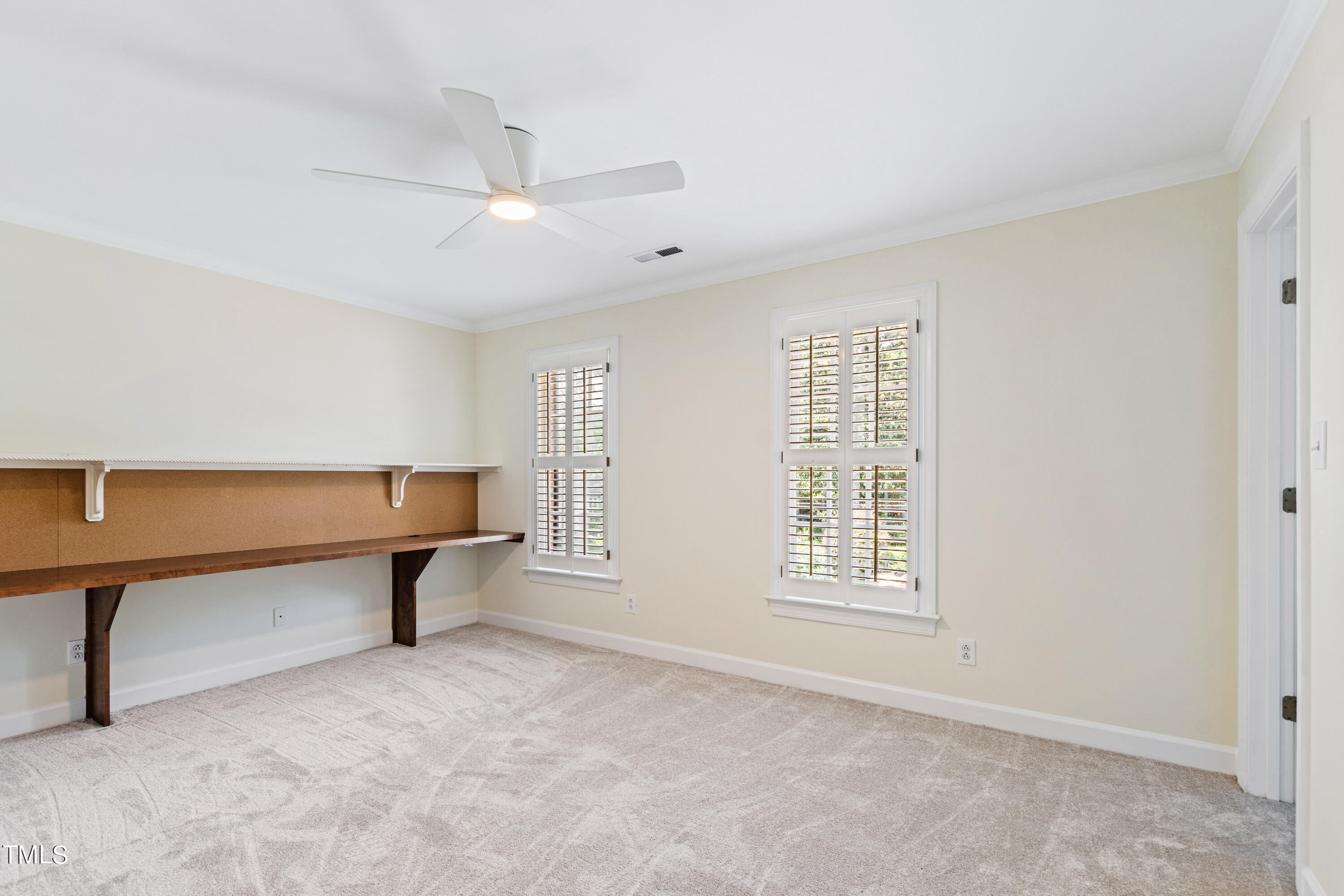 1804 Mcdonald Lane Raleigh, NC 27608 - Photo 40 of 62 a view of an empty room with a window and a ceiling fan