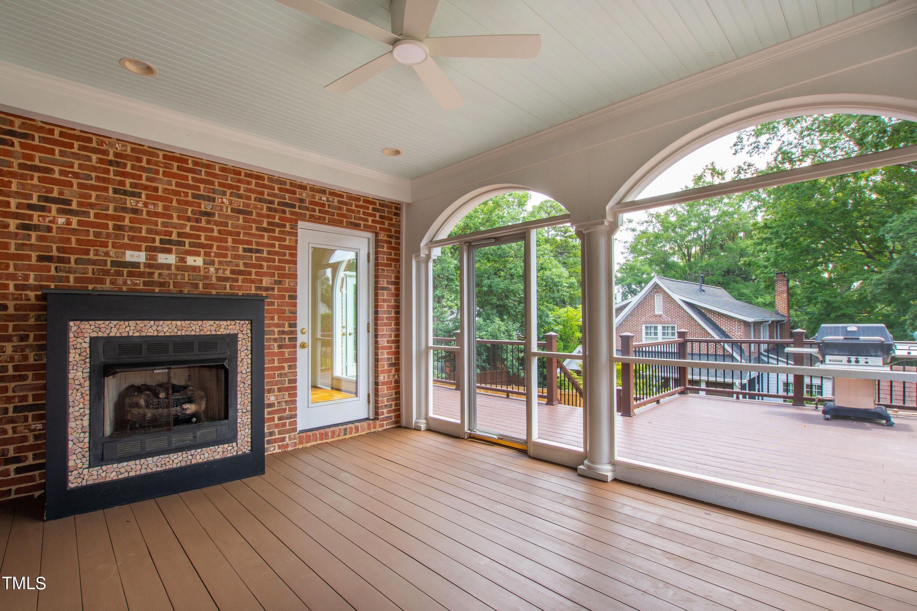1804 Mcdonald Lane Raleigh, NC 27608 - Photo 51 of 62 a view of a livingroom with furniture a fireplace and wooden floor