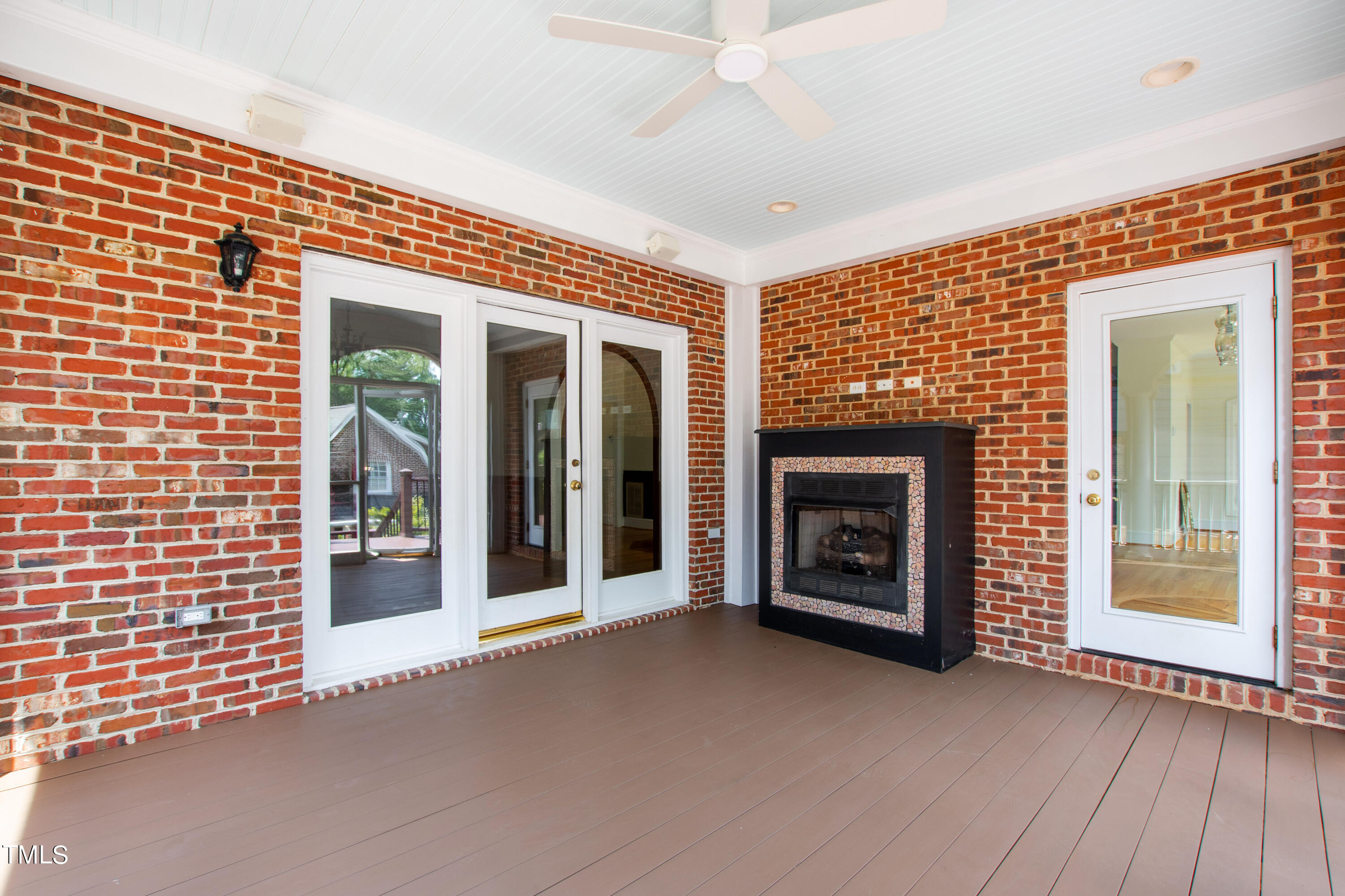 1804 Mcdonald Lane Raleigh, NC 27608 - Photo 52 of 62 a view of a livingroom with a fireplace and window