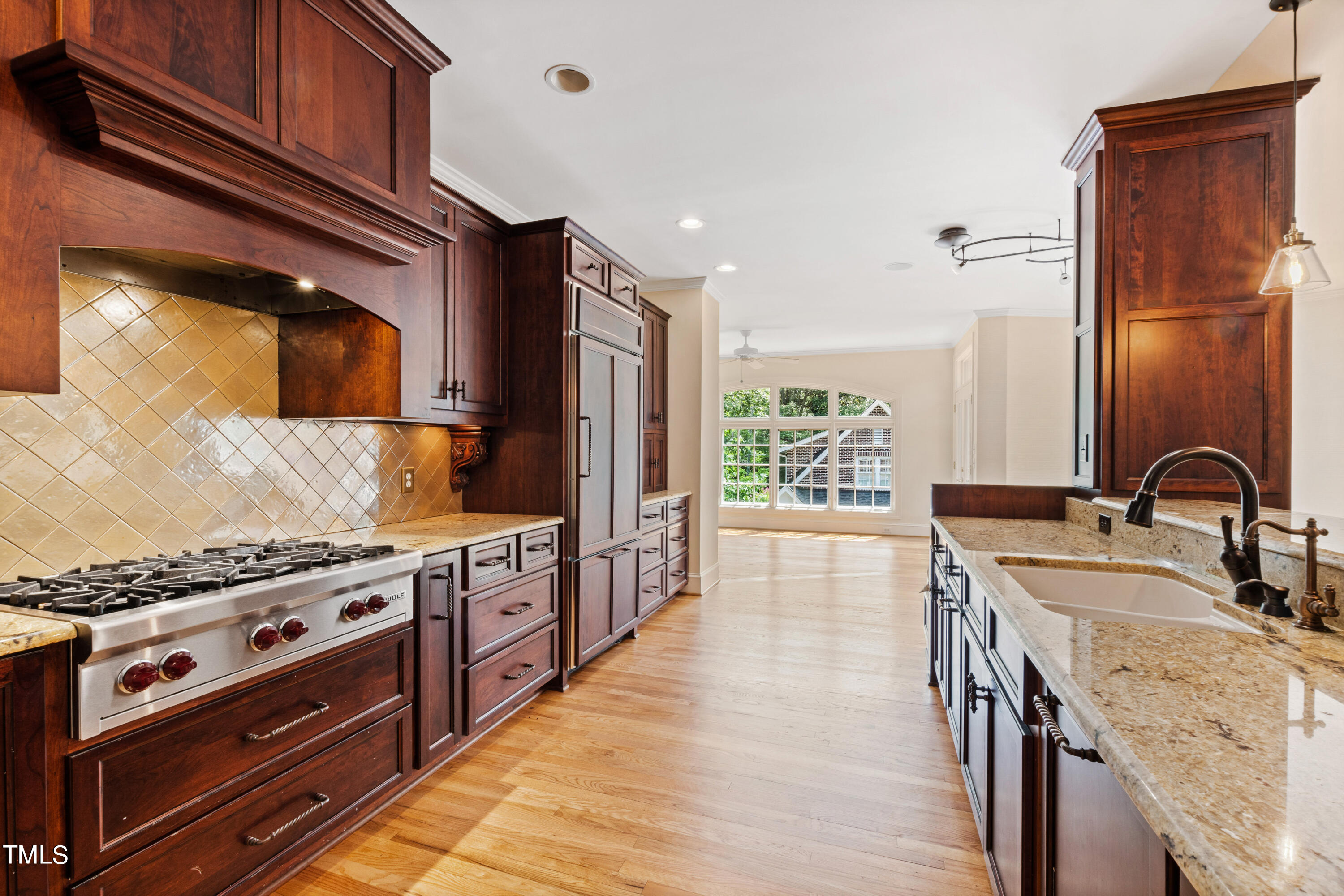1804 Mcdonald Lane Raleigh, NC 27608 - Photo 9 of 62 a kitchen with stainless steel appliances granite countertop a stove and a sink