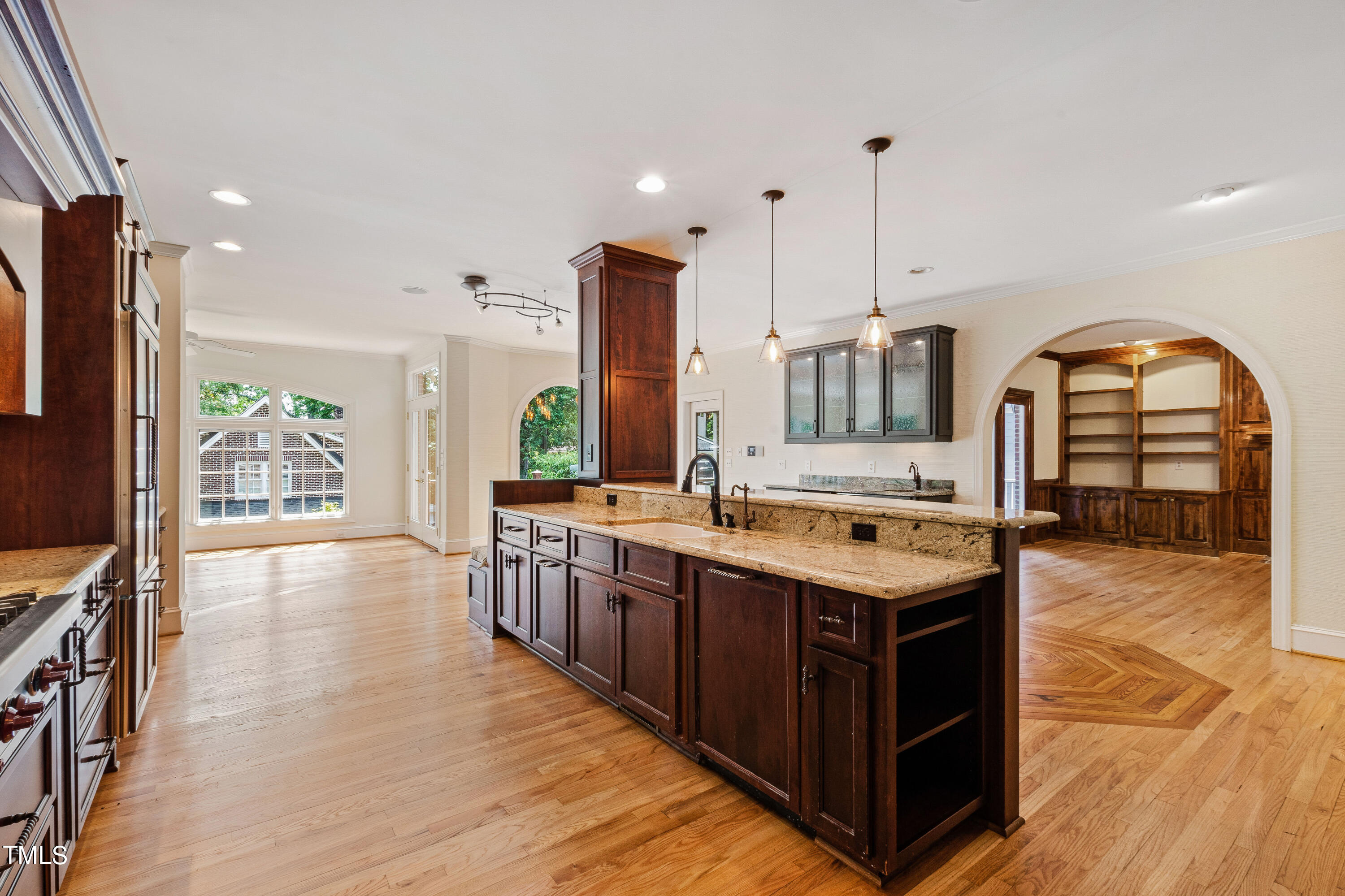 1804 Mcdonald Lane Raleigh, NC 27608 - Photo 10 of 62 a kitchen with stainless steel appliances granite countertop a stove and a wooden floors