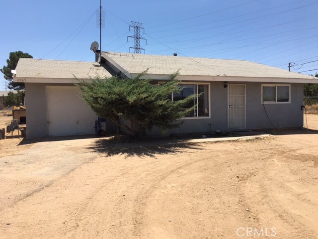 14545 Ranchero Road Hesperia, CA 92345 - Photo 1 of 1 a view of a house with a snow in the yard