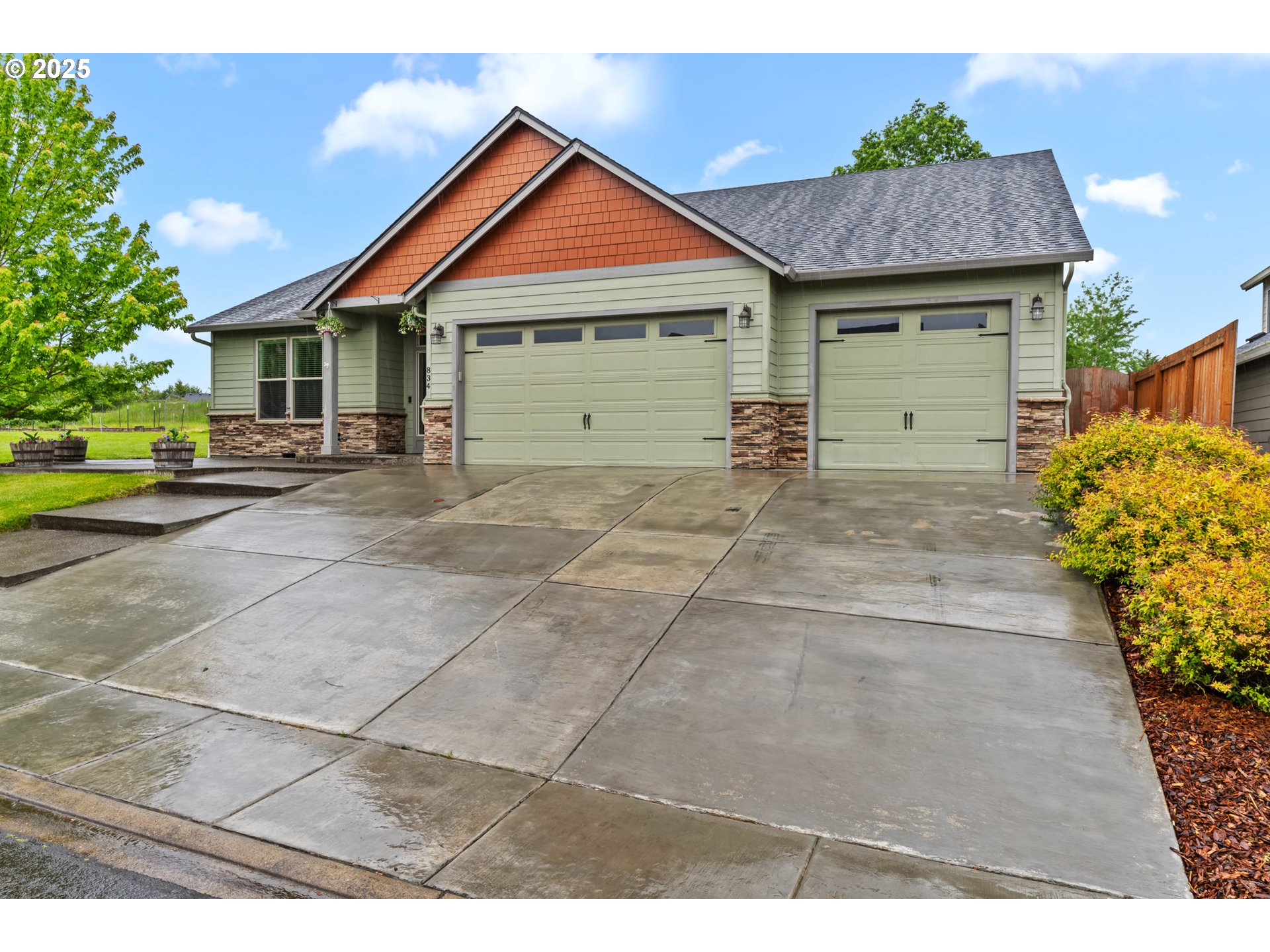 834 North 13th Place Ridgefield, WA 98642 - Photo 18 of 33 a view of a house with a yard and potted plants