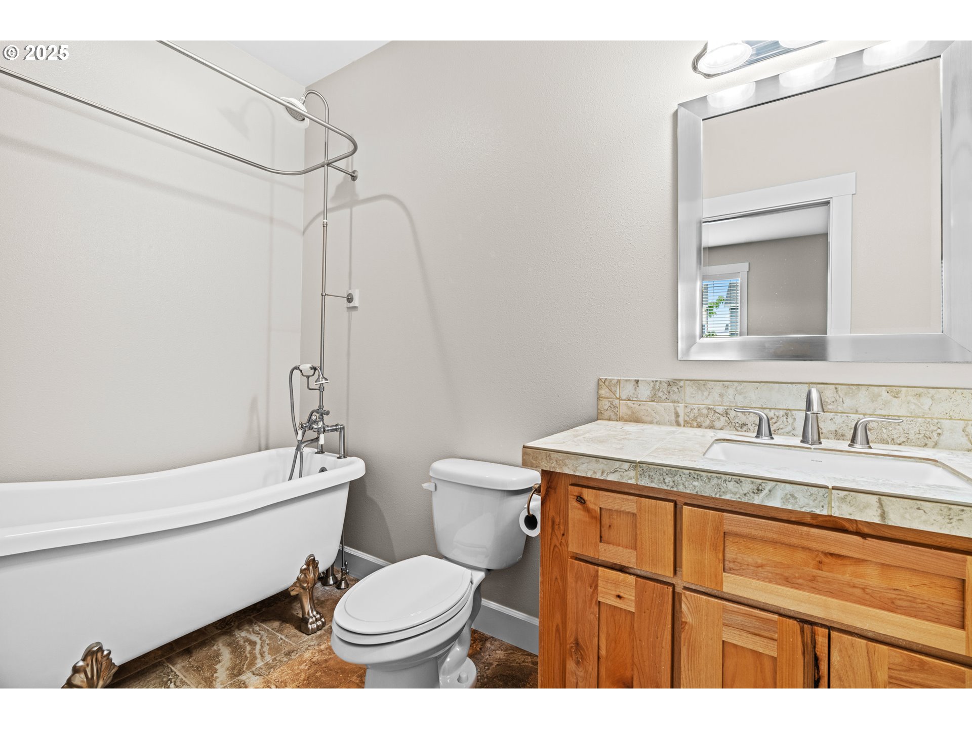 834 North 13th Place Ridgefield, WA 98642 - Photo 22 of 33 a bathroom with a granite countertop toilet sink and mirror