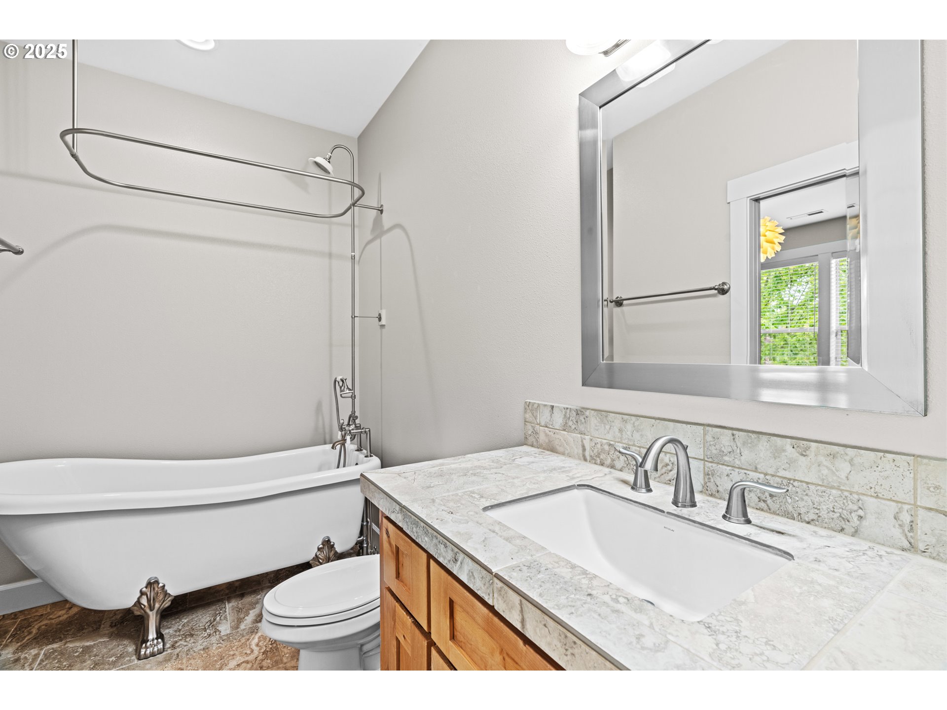 834 North 13th Place Ridgefield, WA 98642 - Photo 23 of 33 a bathroom with a granite countertop sink toilet and shower