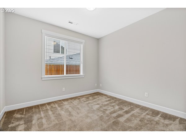 834 North 13th Place Ridgefield, WA 98642 - Photo 30 of 33 a view of an empty room with a window