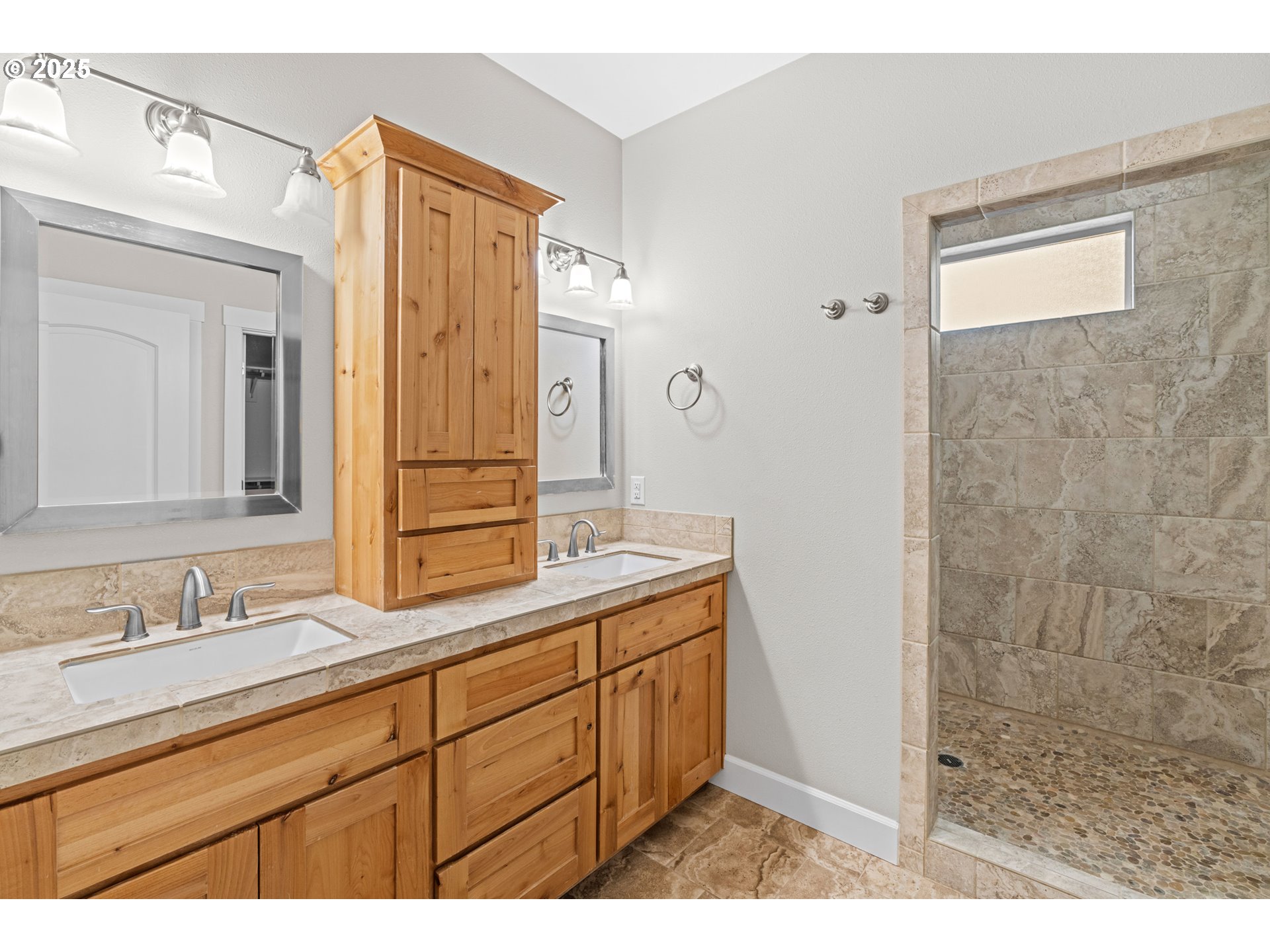 834 North 13th Place Ridgefield, WA 98642 - Photo 10 of 33 a bathroom with a granite countertop sink mirror and double