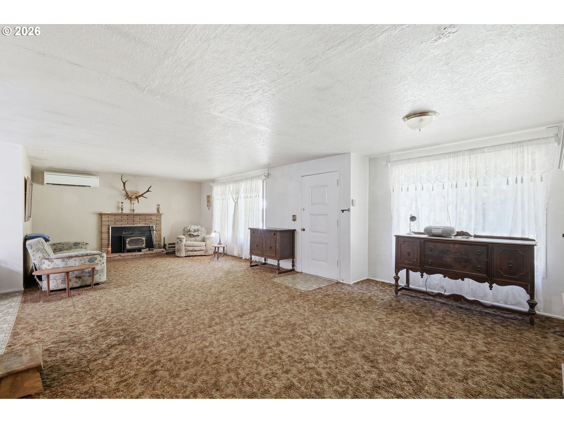 49782 Huckleberry Road Oakridge, OR 97463 - Photo 10 of 21 a living room with furniture and a fireplace