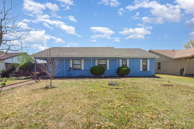a house view with a garden space