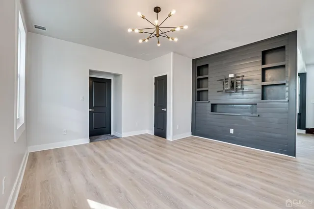 a bathroom with a sink vanity and a shower