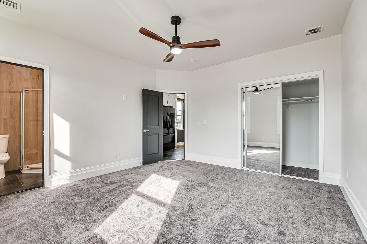 324 Main Street, Unit 2 South Amboy, NJ 08879 - Photo 15 of 26 a view of empty room with wooden floor and ceiling fan