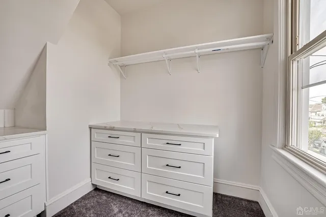 a view of an empty walk in closet