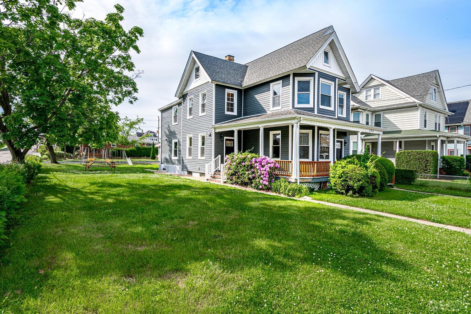 324 Main Street, Unit 2 South Amboy, NJ 08879 - Photo 2 of 26 a front view of building with yard and green space