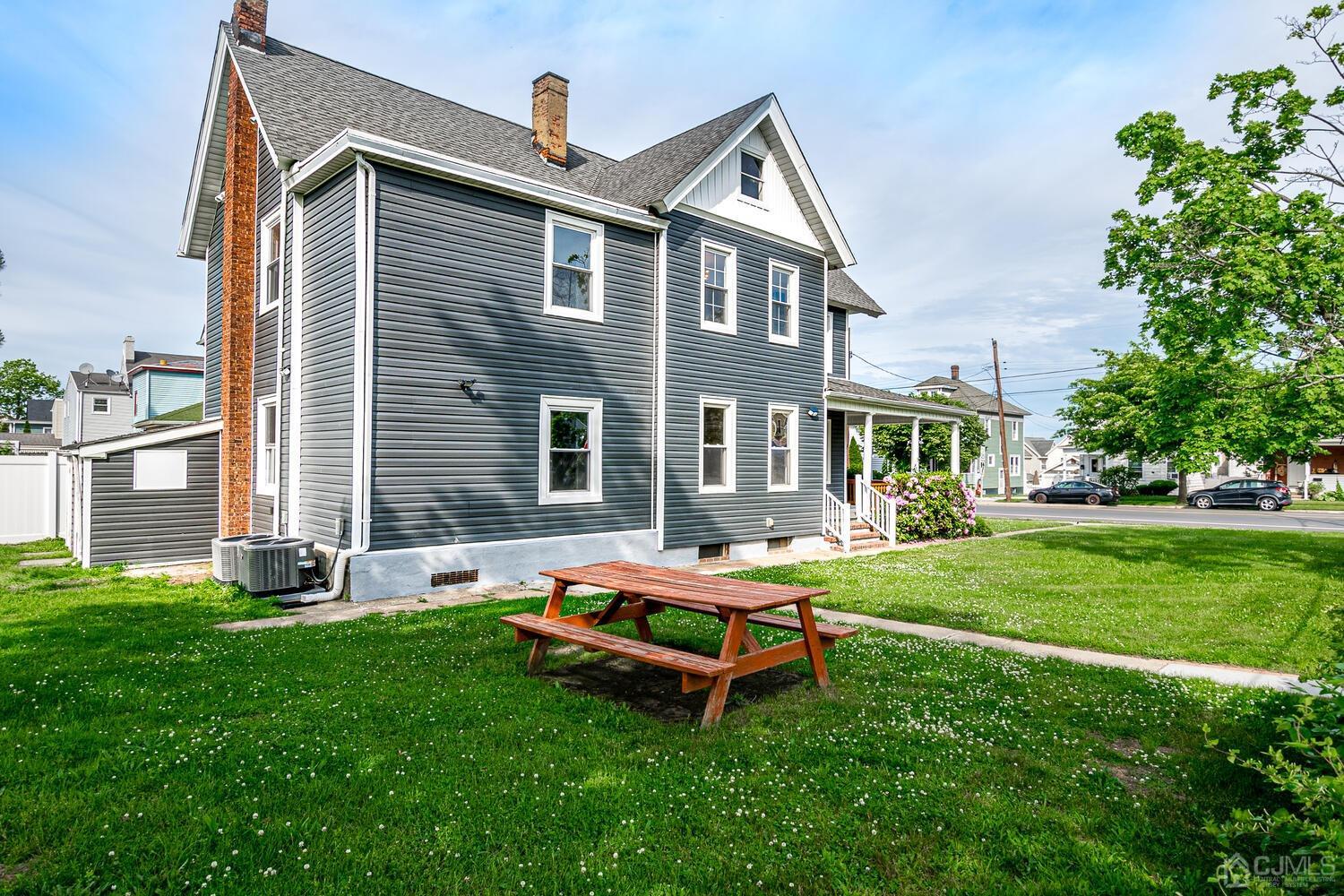324 Main Street, Unit 2 South Amboy, NJ 08879 - Photo 23 of 26 a backyard of a house with table and chairs
