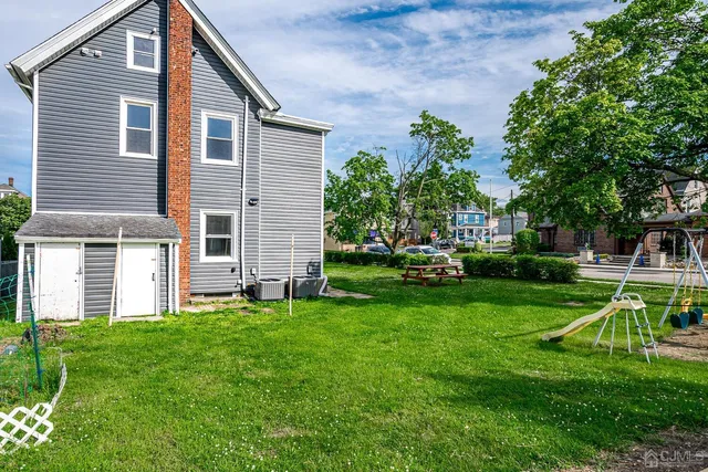 a house view with a sitting space and garden