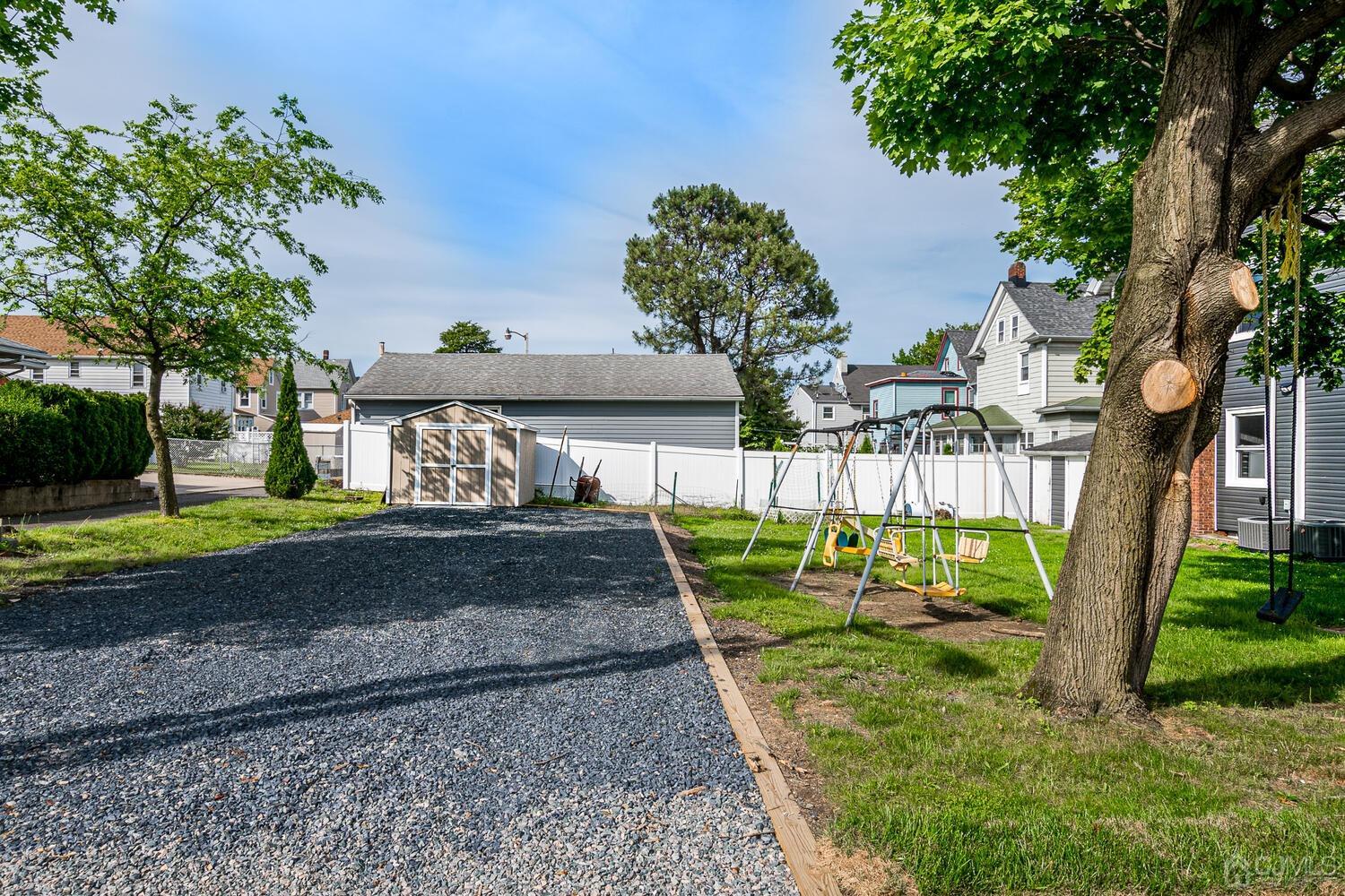 324 Main Street, Unit 2 South Amboy, NJ 08879 - Photo 26 of 26 a view of a yard with yellow house
