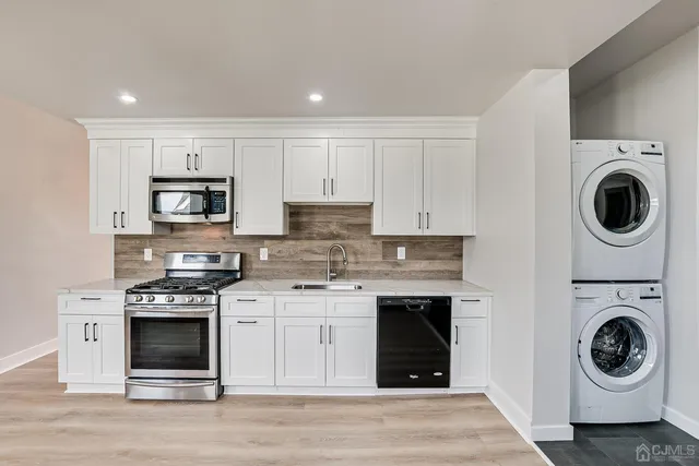 a kitchen with a stove and a microwave