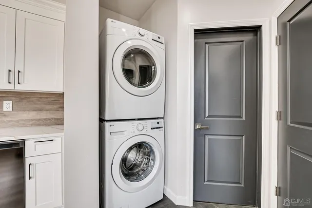 a view of a hallway with washer and dryer