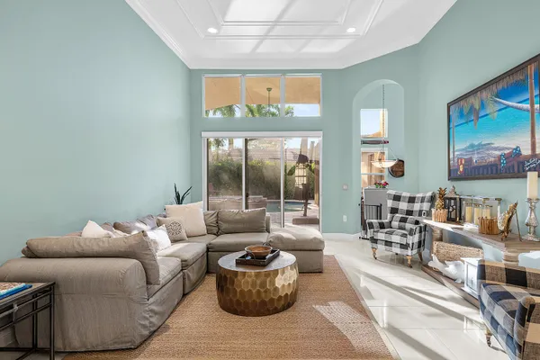 a bathroom with a tub a sink and a large mirror