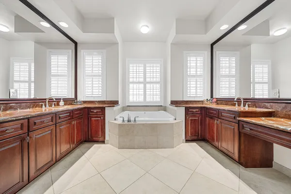 a living room with patio furniture and a flat screen tv