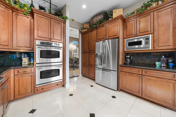 a living room with furniture a table and a large window