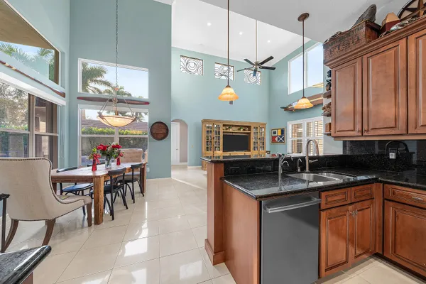 a utility room with cabinets washer and dryer