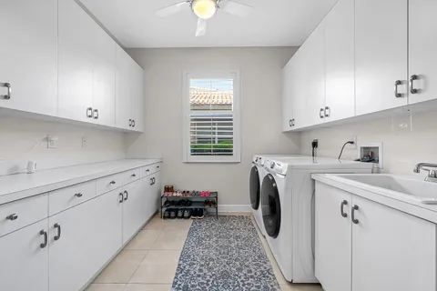 a bedroom with a bed dresser and a flat tv screen