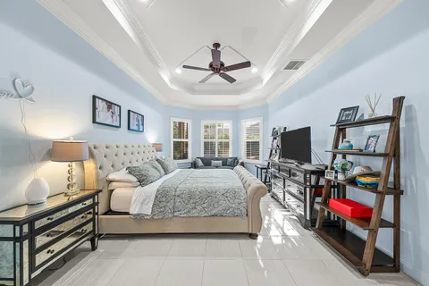 a view of a house with pool fire pit and chairs