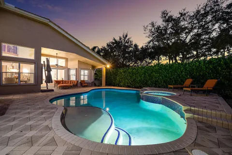 a view of swimming pool with a table and chairs