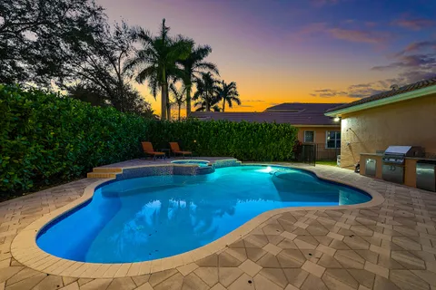a view of swimming pool with chairs