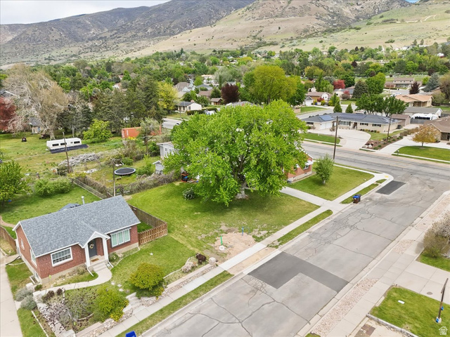 385 East Randall Way South, Unit 2 Centerville, UT 84014 - Photo 5 of 21 Aerial perspective of suburban area with mountains