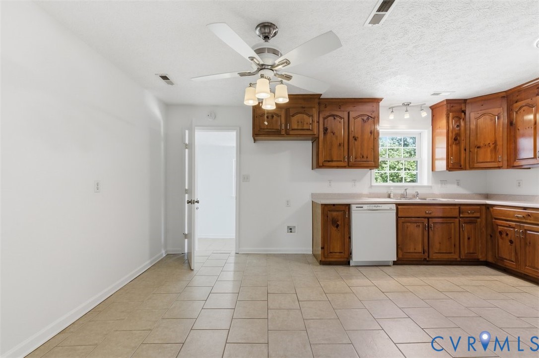 18501 Branders Bridge Road Colonial Heights, VA 23834 - Photo 10 of 43 a kitchen with stainless steel appliances granite countertop a stove a sink and a microwave