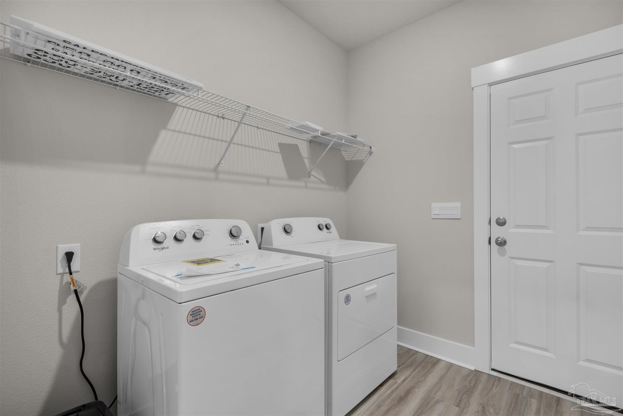 3419 Crossvine Road Cantonment, FL 32533 - Photo 13 of 45 a utility room with dryer and washer
