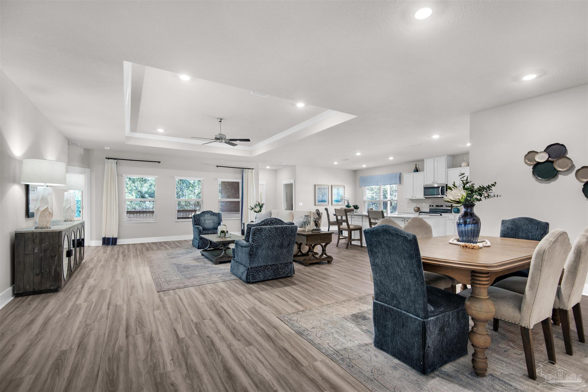 3419 Crossvine Road Cantonment, FL 32533 - Photo 16 of 45 a view of a dining room with furniture window and wooden floor