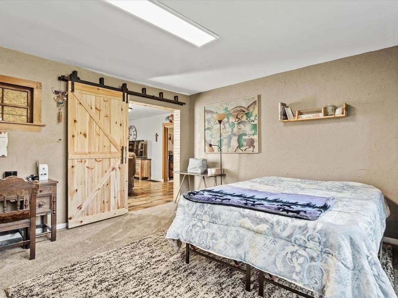 3669 G Road Palisade, CO 81526 - Photo 12 of 40 a bedroom with a bed dresser and a window