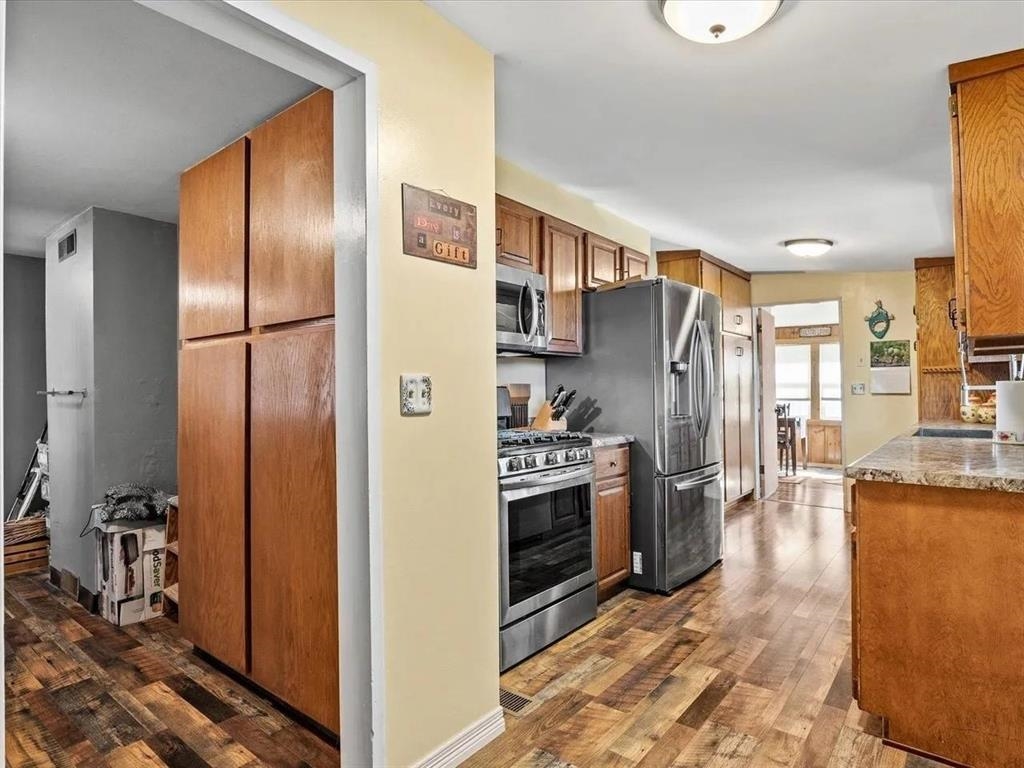 3669 G Road Palisade, CO 81526 - Photo 15 of 40 a kitchen with stainless steel appliances granite countertop a refrigerator and a stove