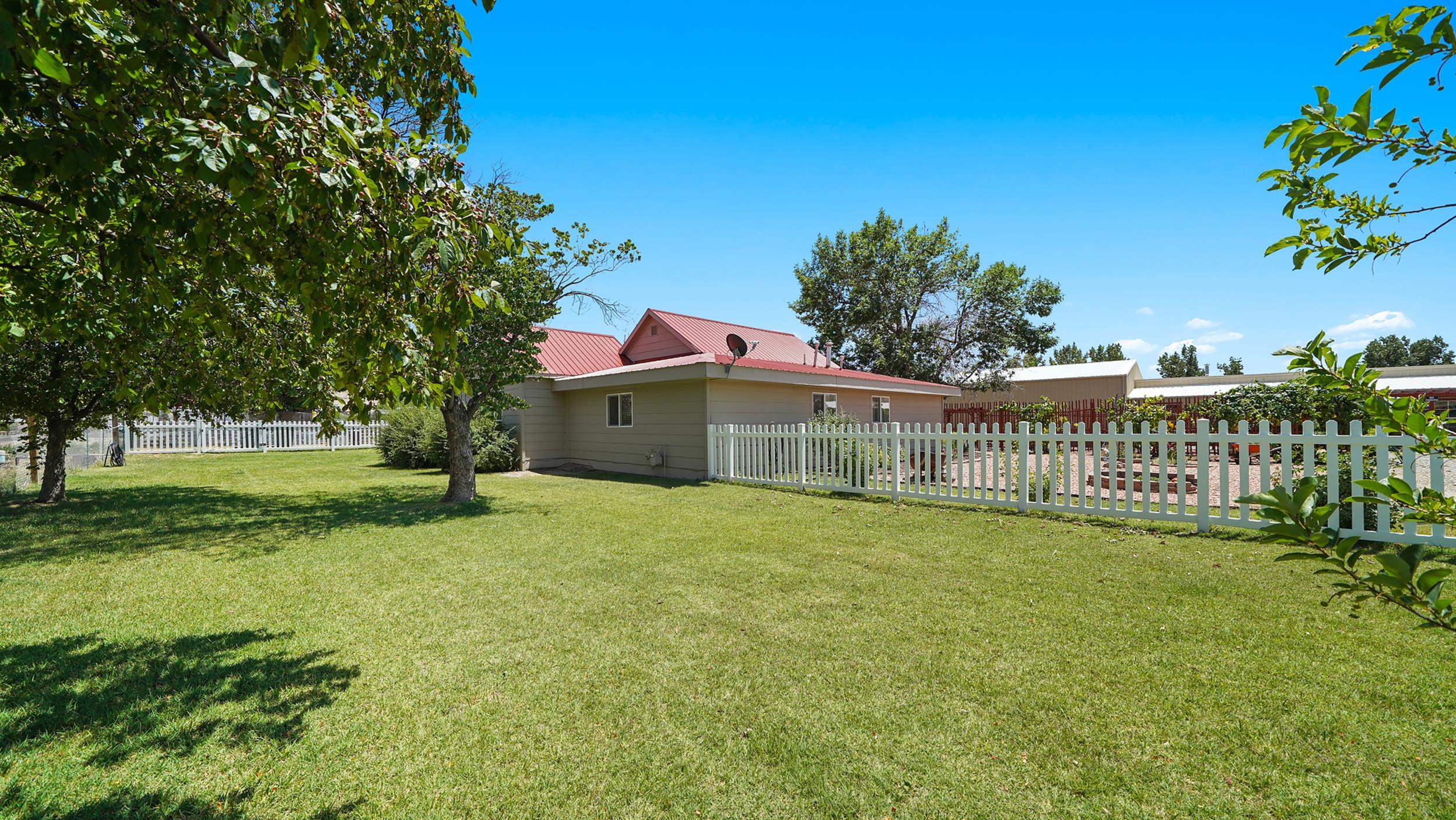 3669 G Road Palisade, CO 81526 - Photo 2 of 40 a front view of a house with a yard
