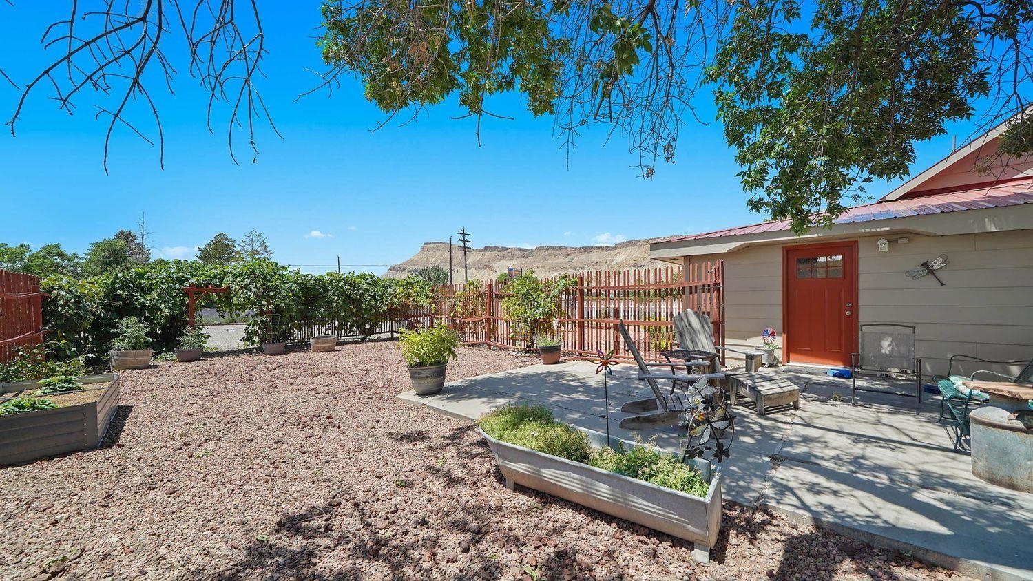 3669 G Road Palisade, CO 81526 - Photo 28 of 40 a view of a backyard with sitting area
