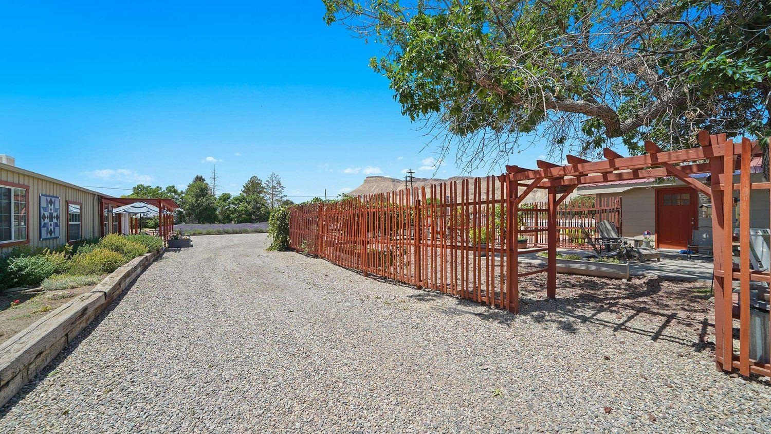 3669 G Road Palisade, CO 81526 - Photo 29 of 40 a view of a house with wooden fence