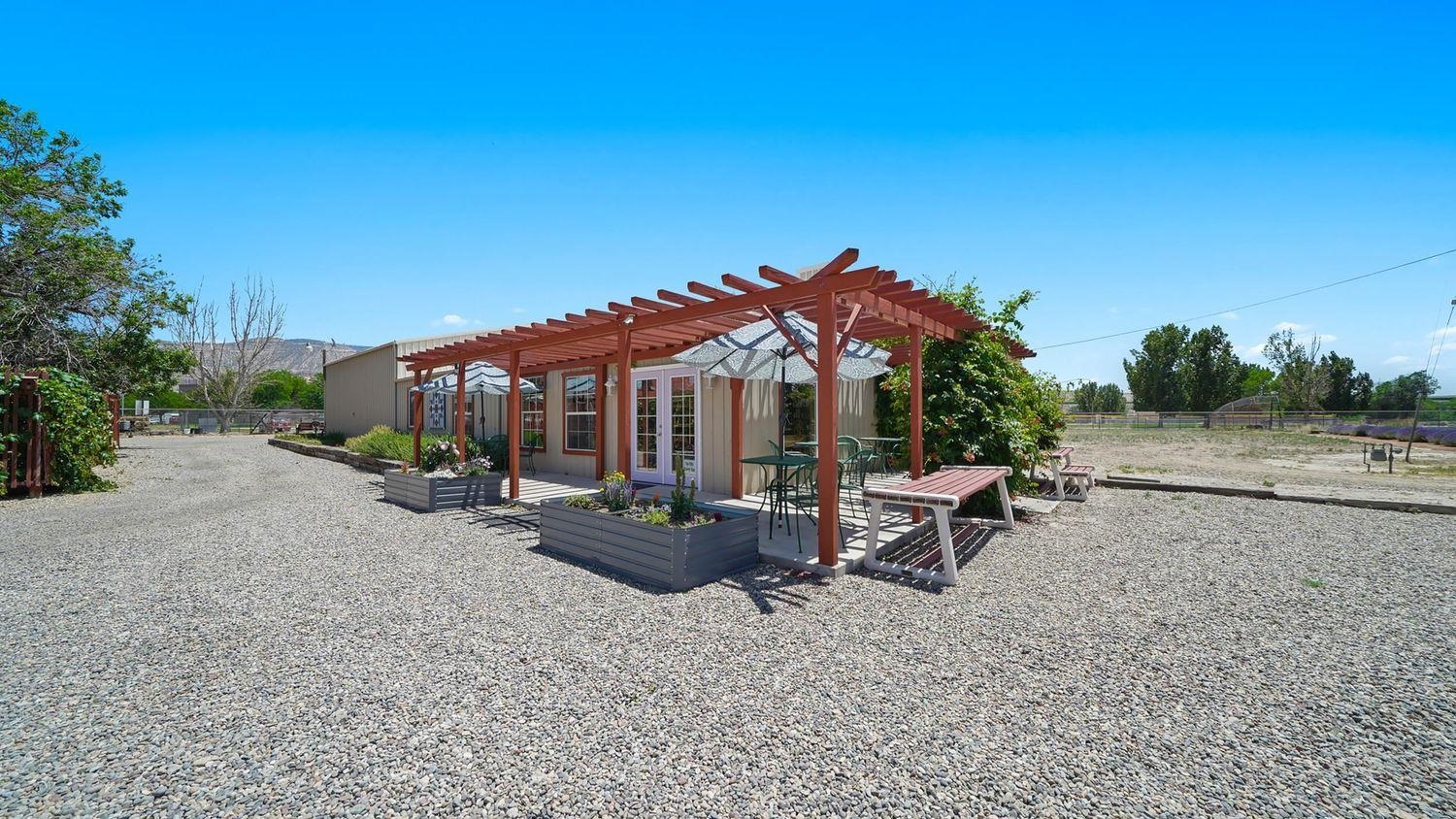 3669 G Road Palisade, CO 81526 - Photo 3 of 40 a view of a house with backyard and sitting area