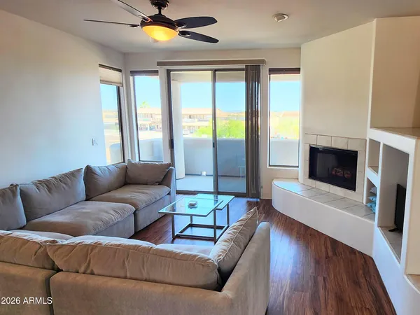 a living room with furniture and a fireplace