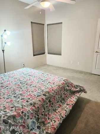 a bedroom with bed and window