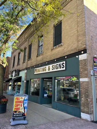 a front view of building with retail shop and retail shops