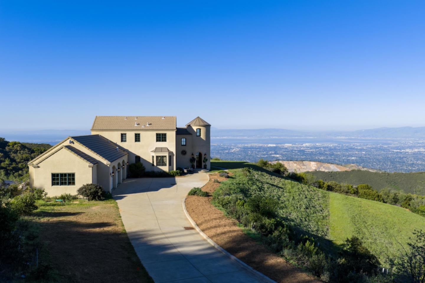 17599 Montebello Road Cupertino, CA 95014 - Photo 59 of 83 a front view of a house with a yard
