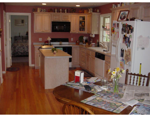 120 Freeman Road Charlton, MA 01507 - Photo 3 of 8 a kitchen view of a kitchen island sink stove and microwave